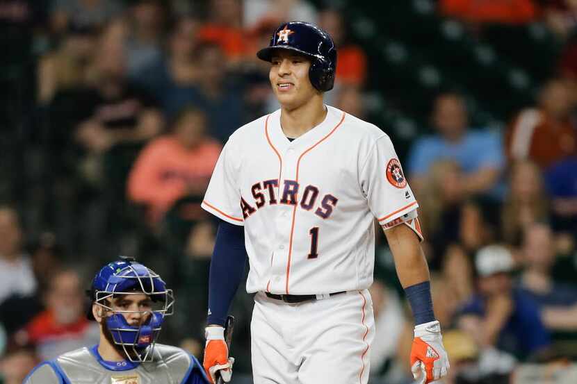 HOUSTON, TX - AUGUST 04: Carlos Correa #1 of the Houston Astros walks back to the dugout...