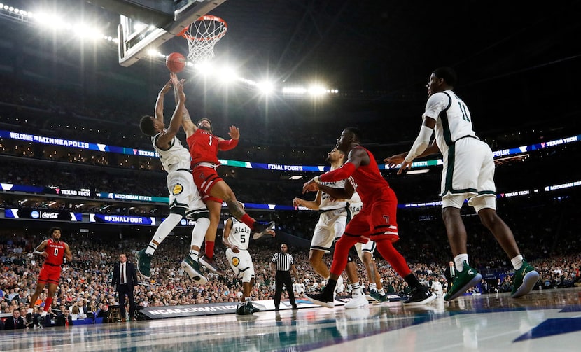 Texas Tech Red Raiders guard Brandone Francis (1) attempts a layup in front of Michigan...