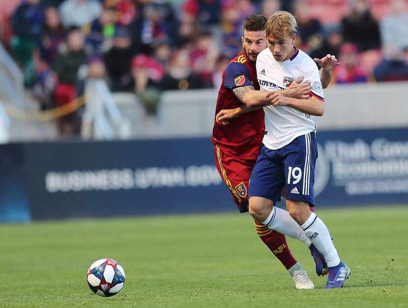 Real Salt Lake midfielder Kyle Beckerman (5) and FC Dallas midfielder Paxton Pomykal (19)...