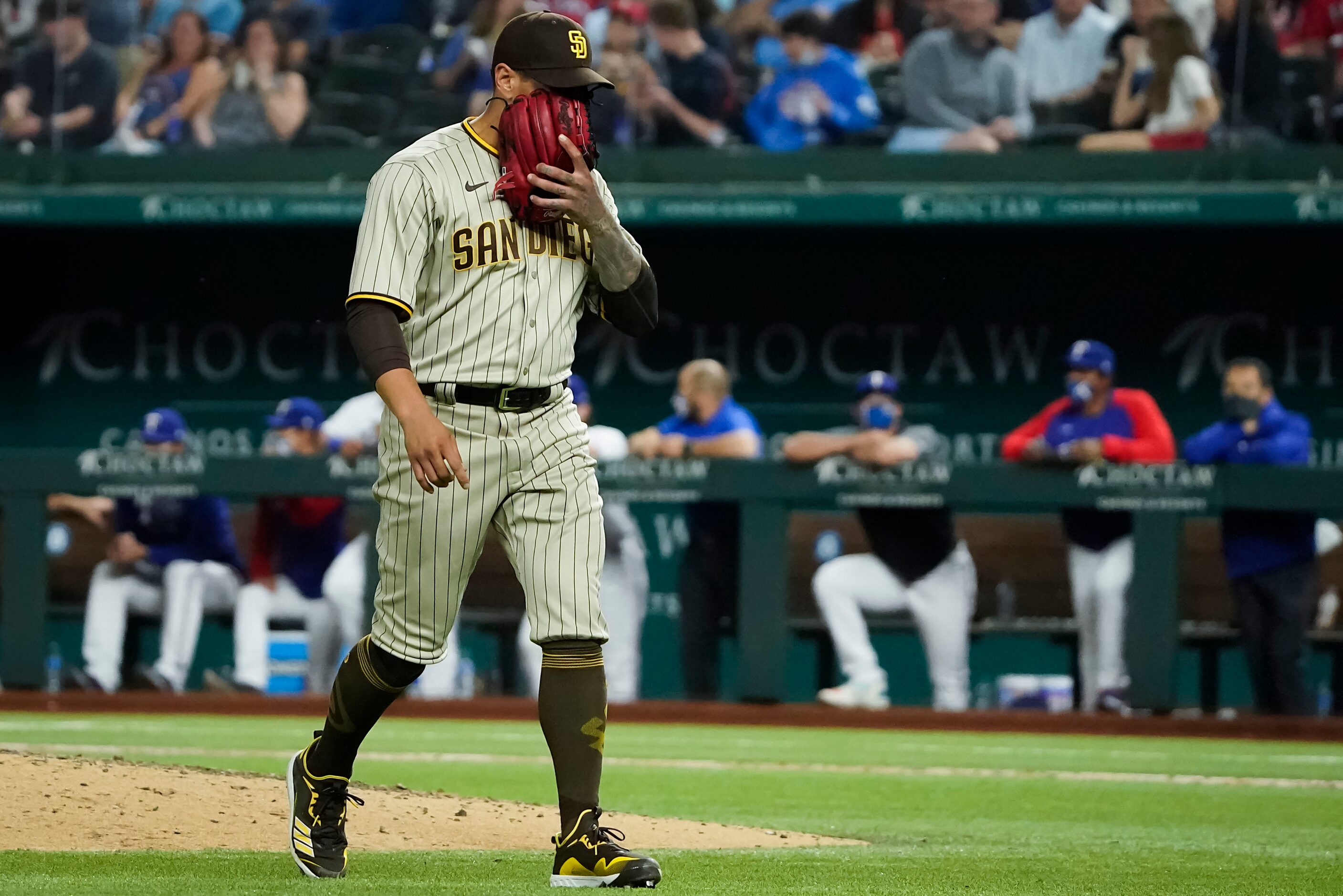 San Diego Padres relief pitcher Keone Kela reacts after being lifted from the game during...