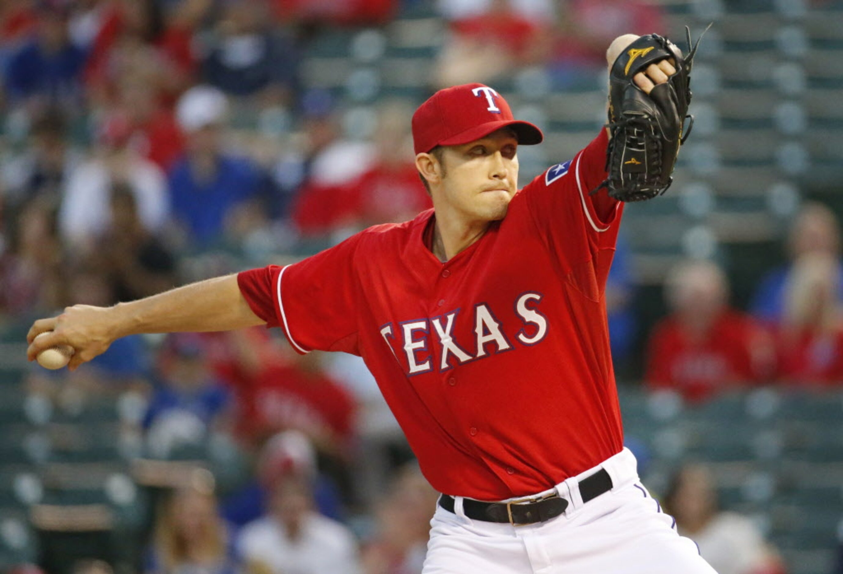 Texas starting pitcher Scott Baker throws a first inning pitch during the Oakland Athletics...