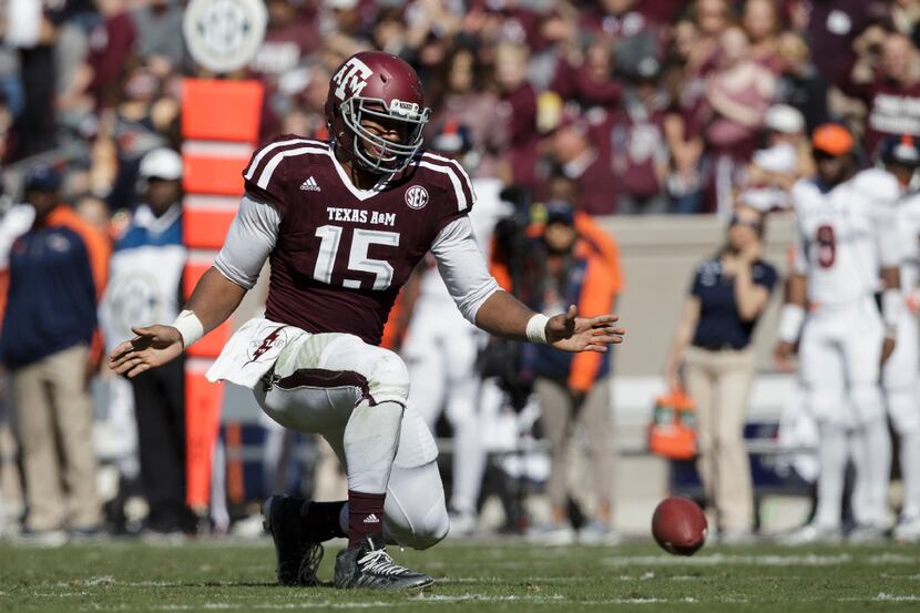 Texas A&M defensive lineman Myles Garrett (15) reacts after knocking down a pass against...