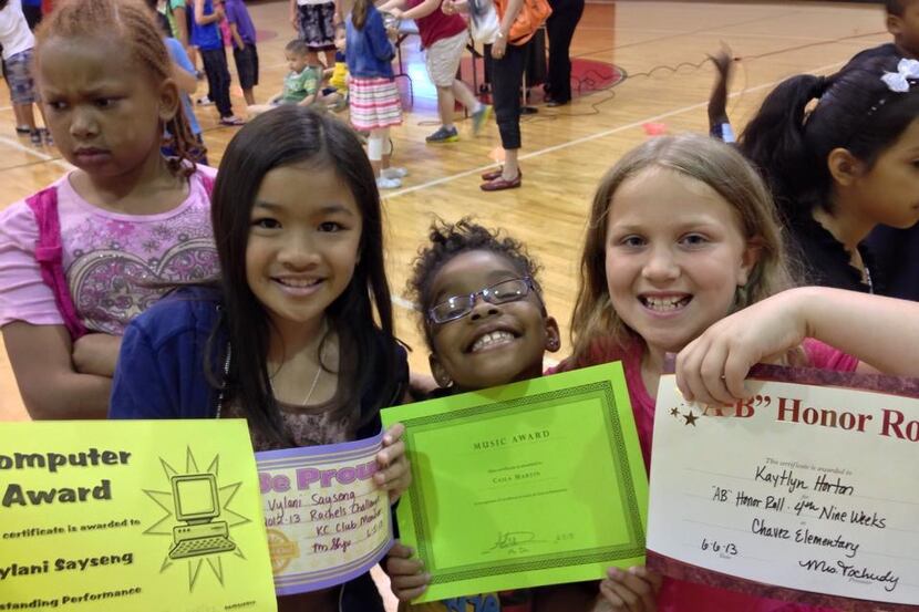 Third-grader Caila Martin , third from left, received a music award for the 2012-13 school...