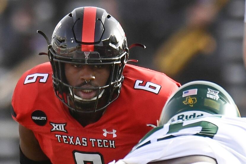 Texas Tech linebacker Riko Jeffers (6) watches the Baylor quarterback during the first half...