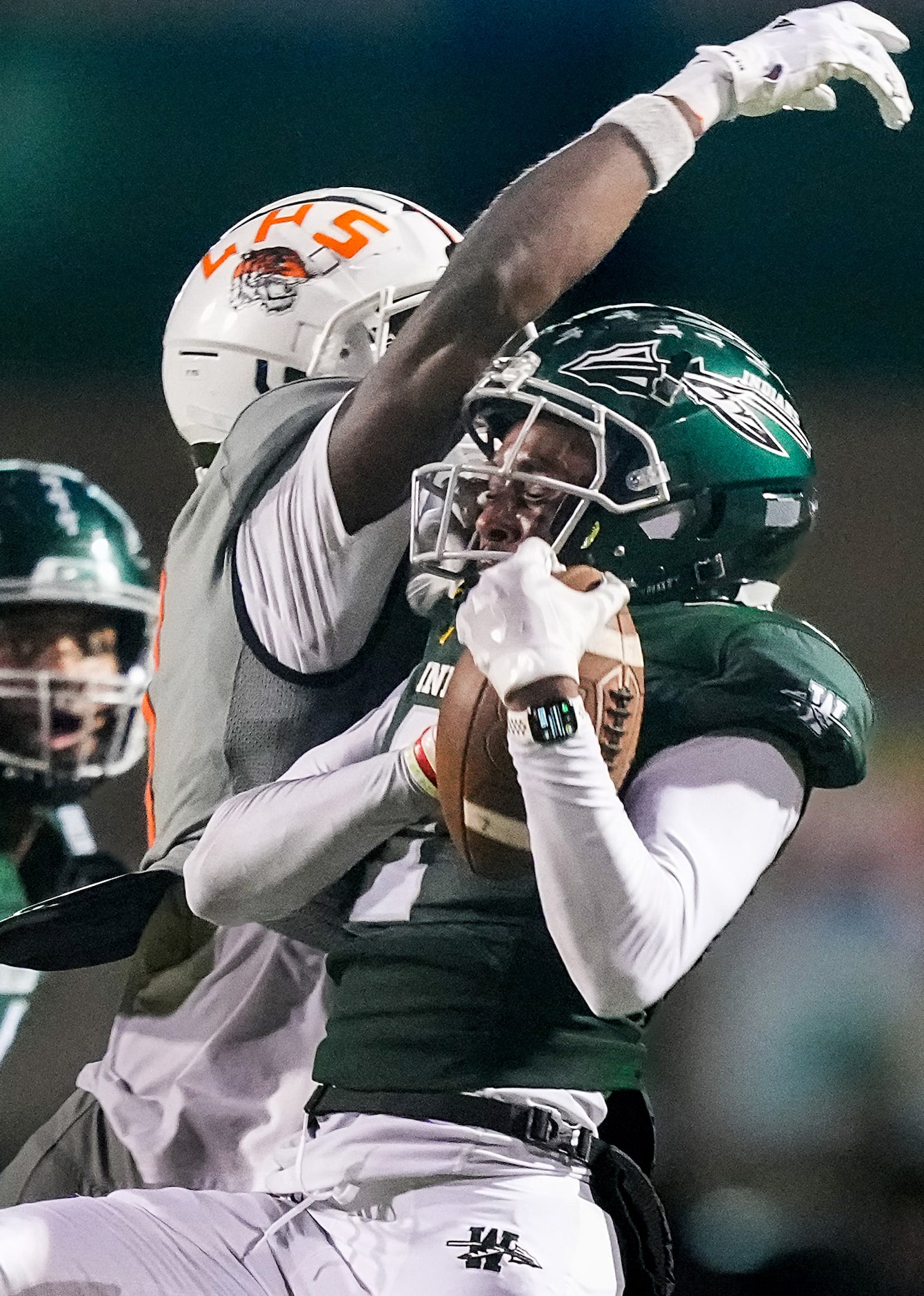 Waxahachie cornerback Elijah Thompson (7) intercepts a pass intended for Lancaster wide...