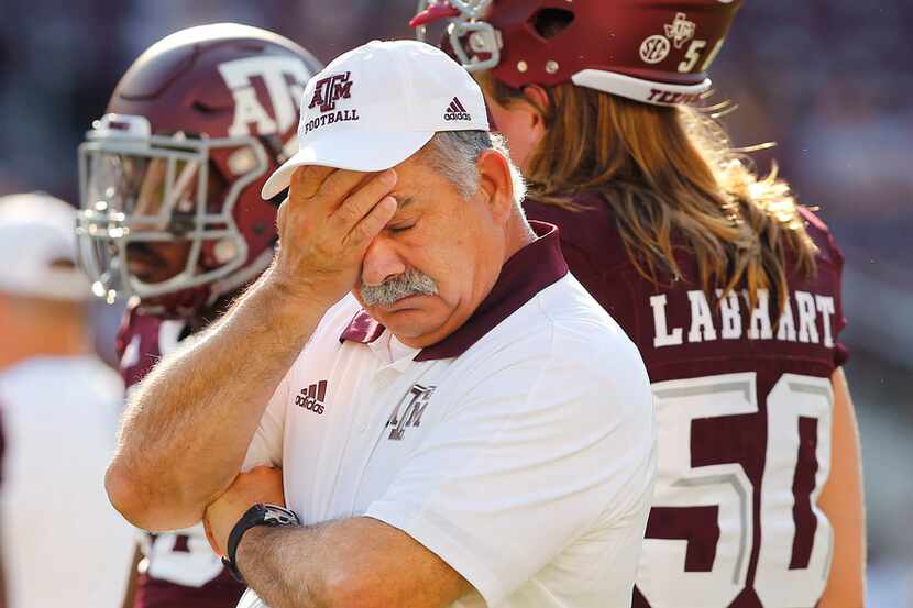 Texas A&M Aggies defensive coordinator John Chavis watches his players warm up before facing...
