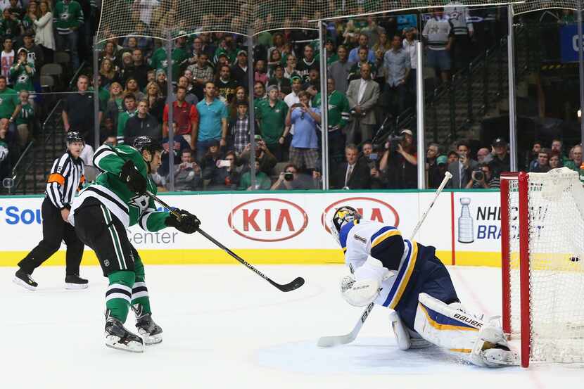 DALLAS, TX - APRIL 03: Travis Moen #27 of the Dallas Stars scores on a penalty shot against...