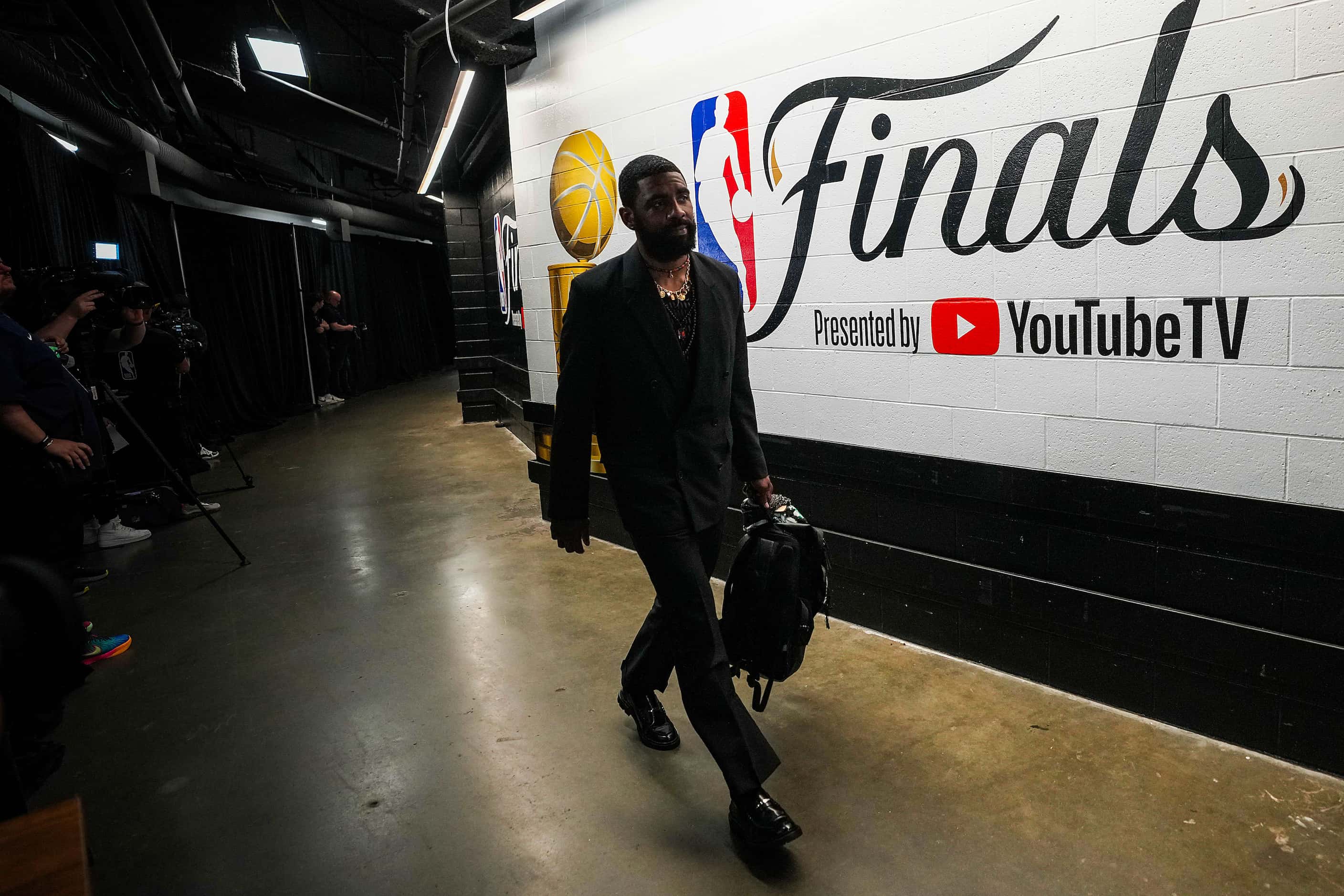 Dallas Mavericks guard Kyrie Irving arrives at TD Garden before Game 2 of the NBA Finals...