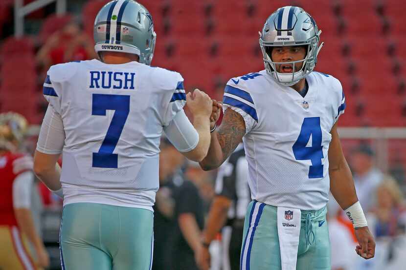 Dallas Cowboys quarterbacks Dak Prescott (4) and Cooper Rush warm up during the pre-season...