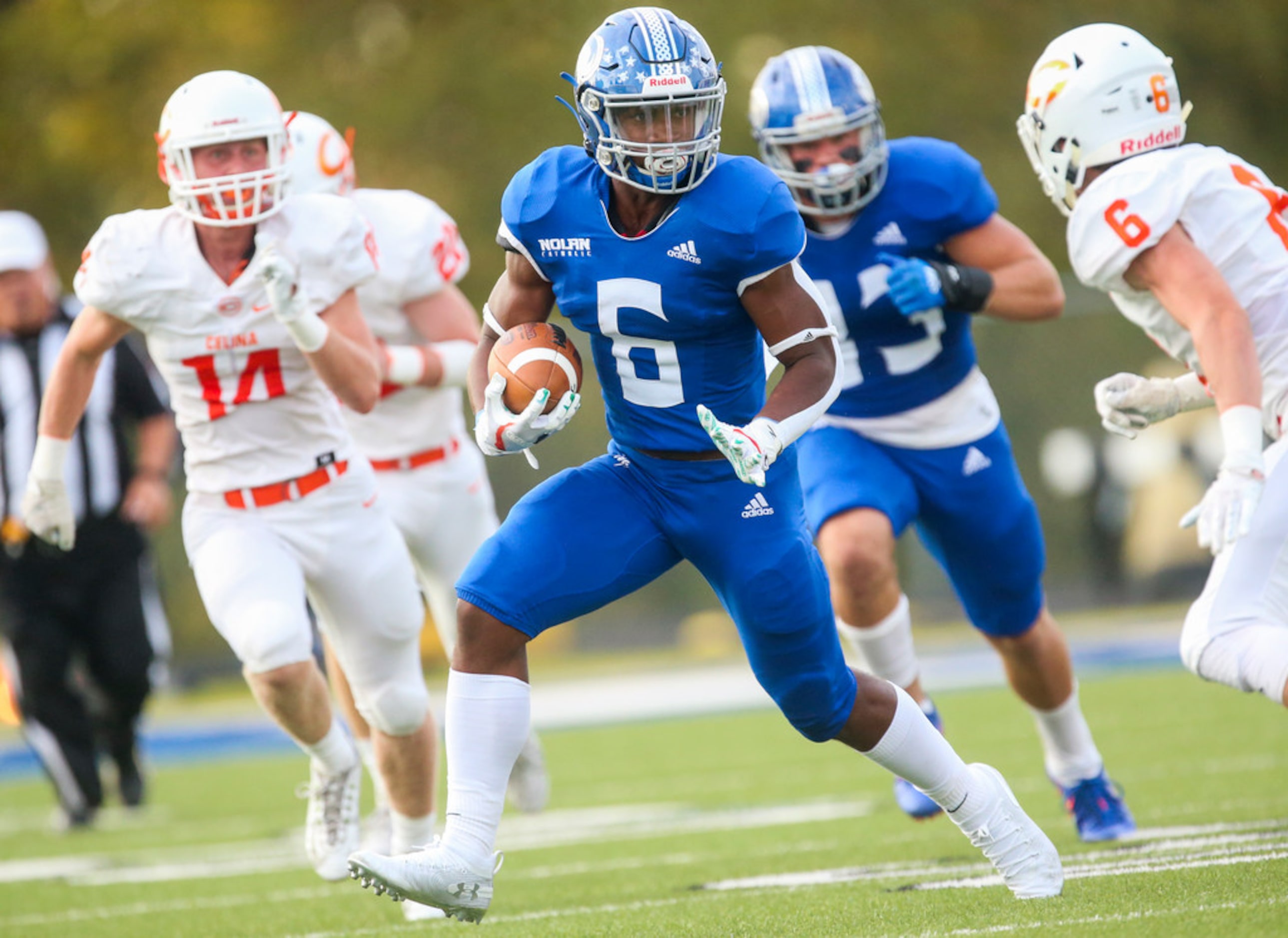 Nolan Catholic running back Emeka Magwa (6) carries the ball during a high schools football...