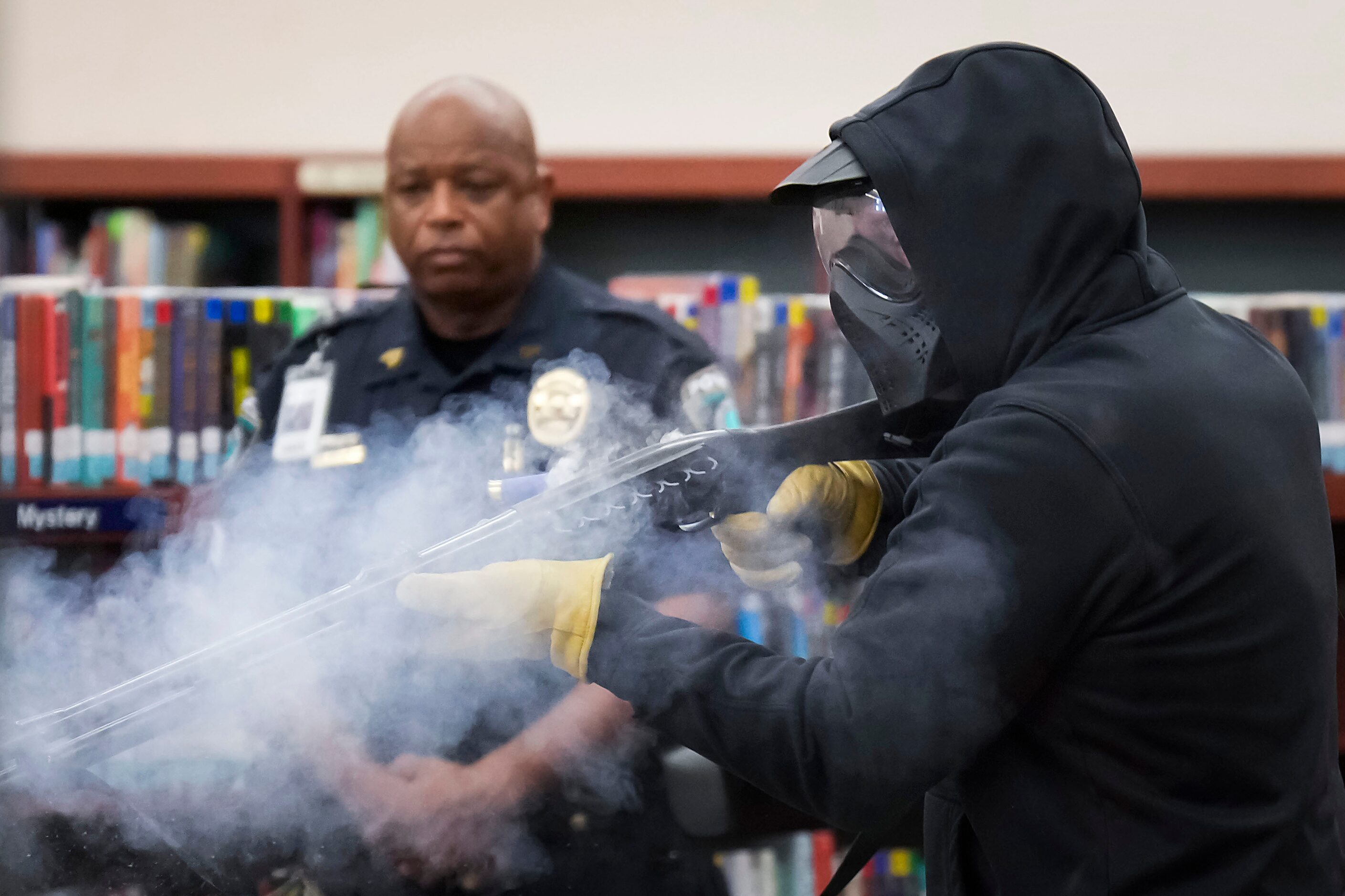 Taylor County sheriff's deputy Brad Gailey portrays an active shooter as Round Rock ISD...