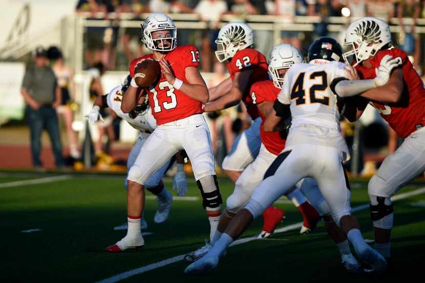 Argyle junior quarterback Bo Hogeboom (13) prepares to throw the ball for a play against...