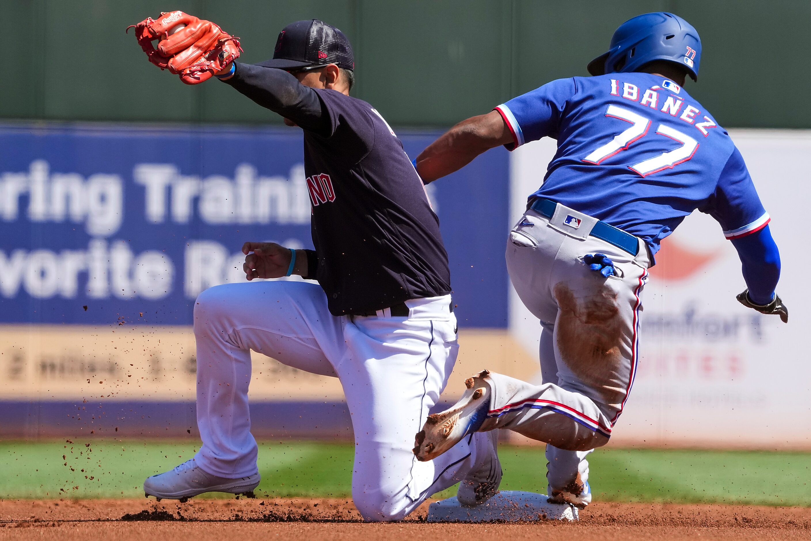 Texas Rangers infielder Andy Ibáñez is forced out at second base by Cleveland Guardians...