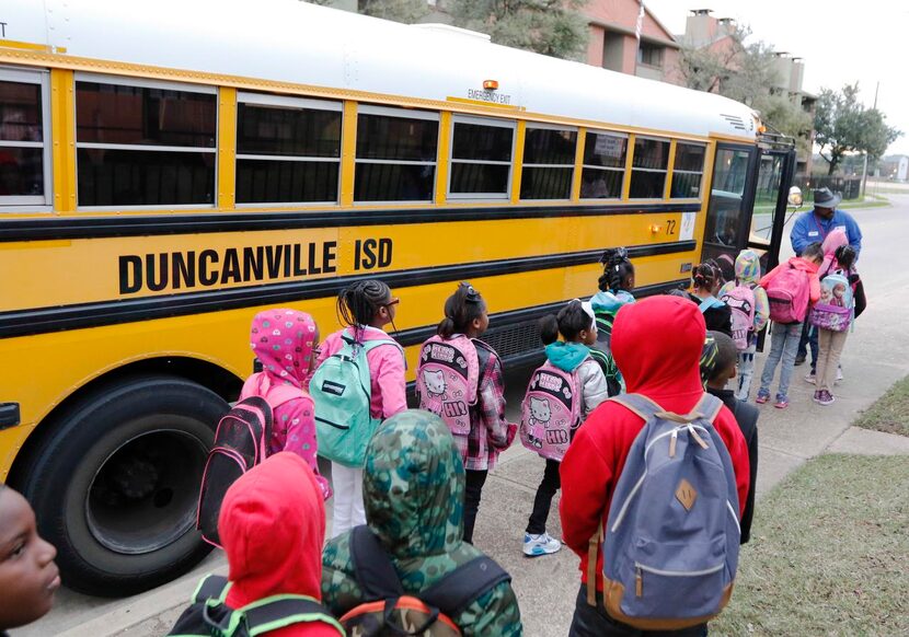 
Lynch welcomes students as they board his bus. He drove 18-wheelers for a while, but...