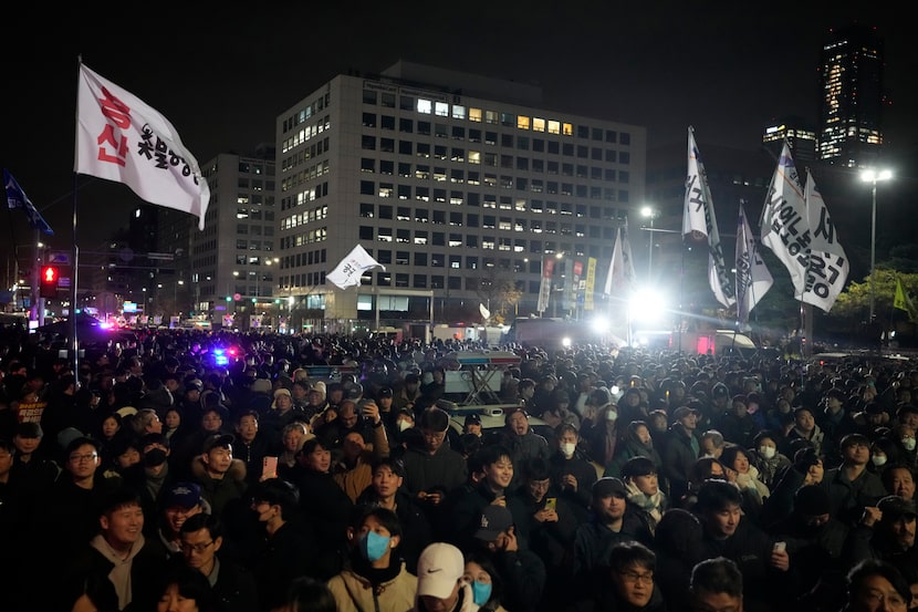 People gather in front of the National Assembly in Seoul, South Korea, Wednesday, Dec. 4,...