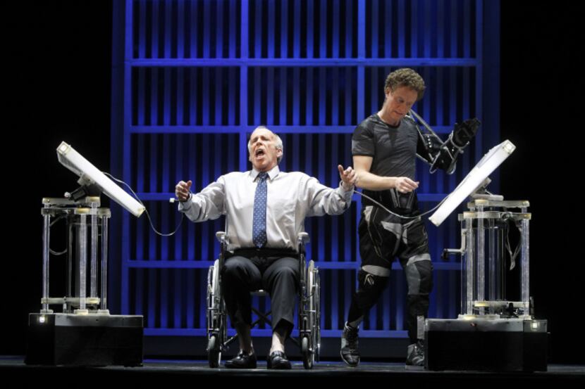 Robert Orth sings while Hal Cazalet interfaces with the Operabots during the Dallas Opera's...