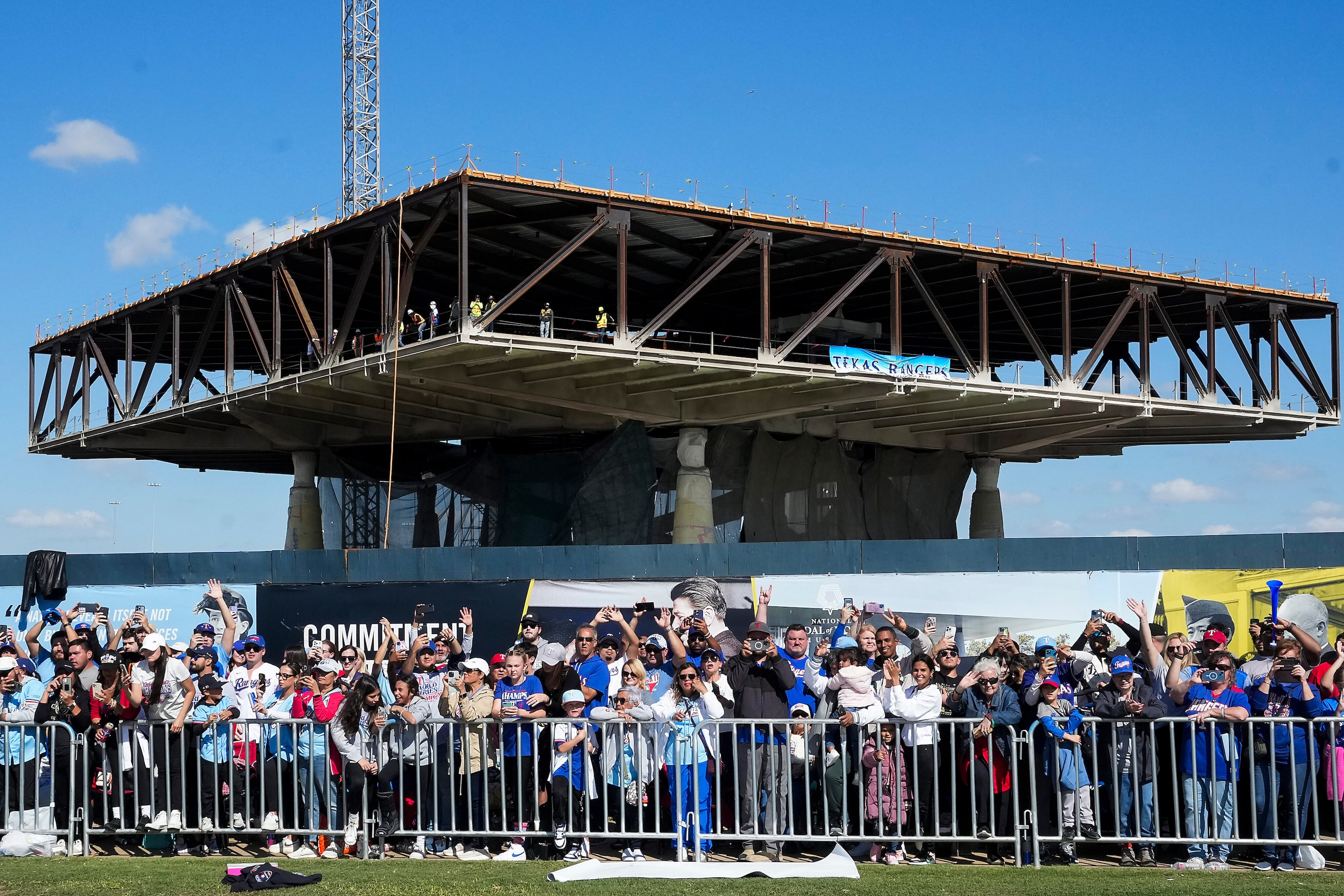 Workers at the site of the under construction National Medal of Honor Museum pause to watch...