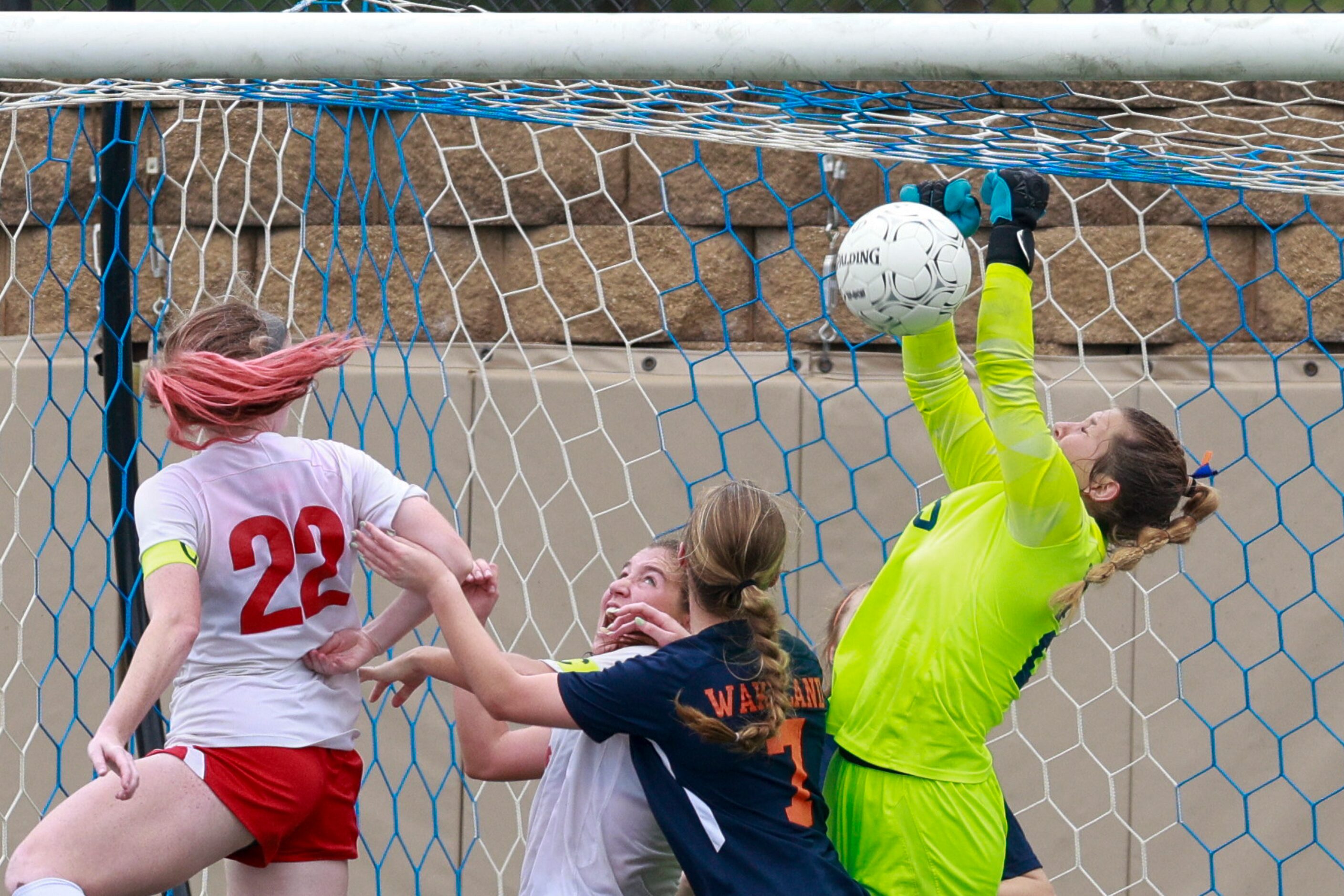 Frisco Wakeland goalkeeper Drew Stover (23) clears a last second shot attempt during...