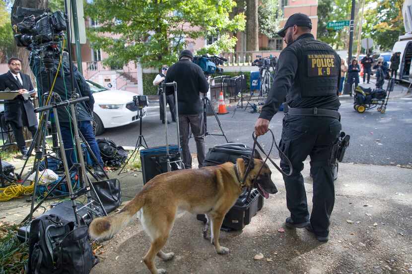 An officer with the Uniform Division of the United States Secret Service used his dog to...