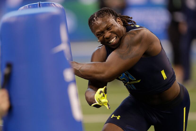 UCLA defensive end Takkarist Mckinley runs a drill at the NFL football scouting combine...