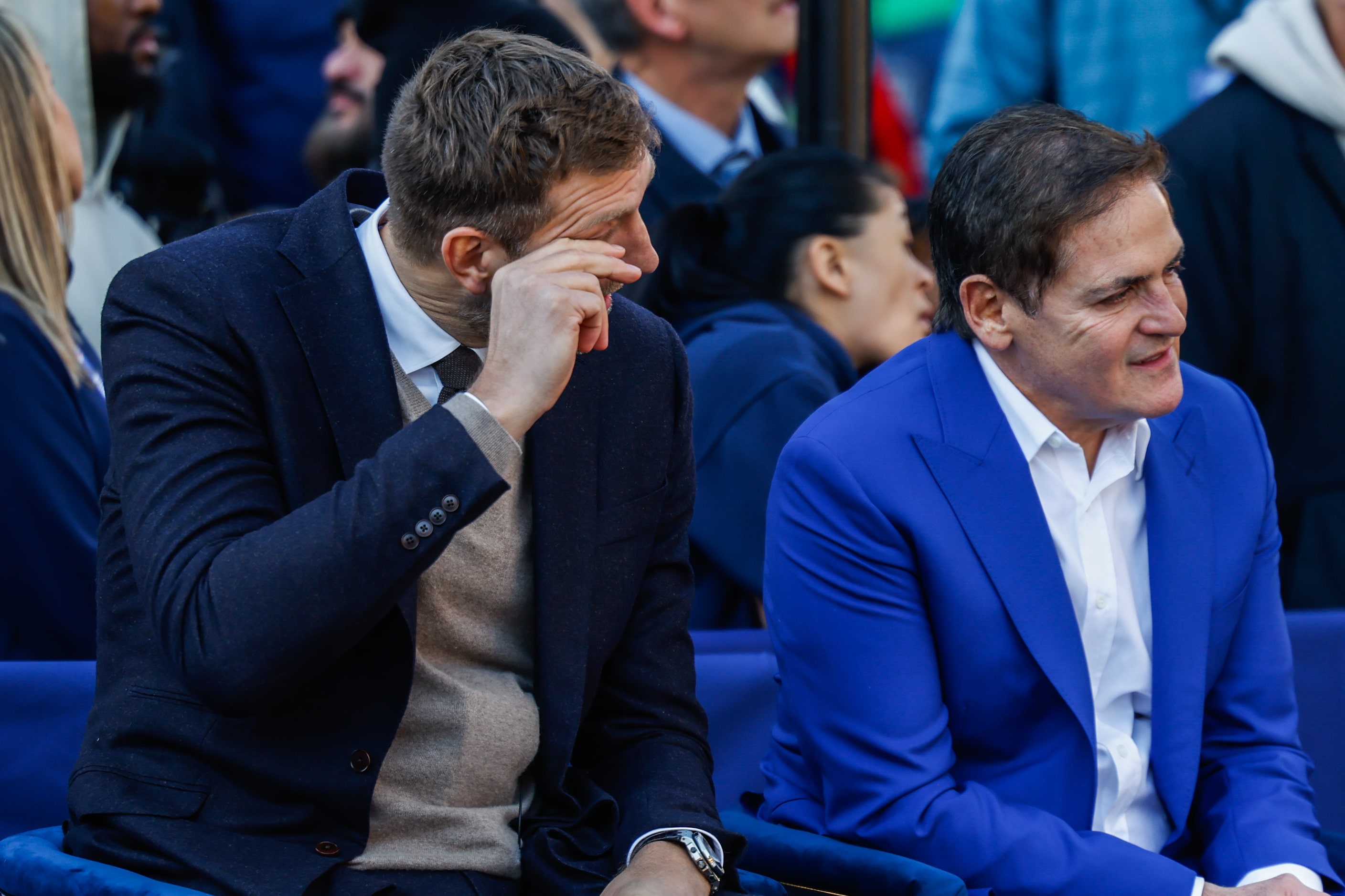 Dirk Nowitzki, left, gets emotional next to Mark Cuban during the Christmas Day ceremony...