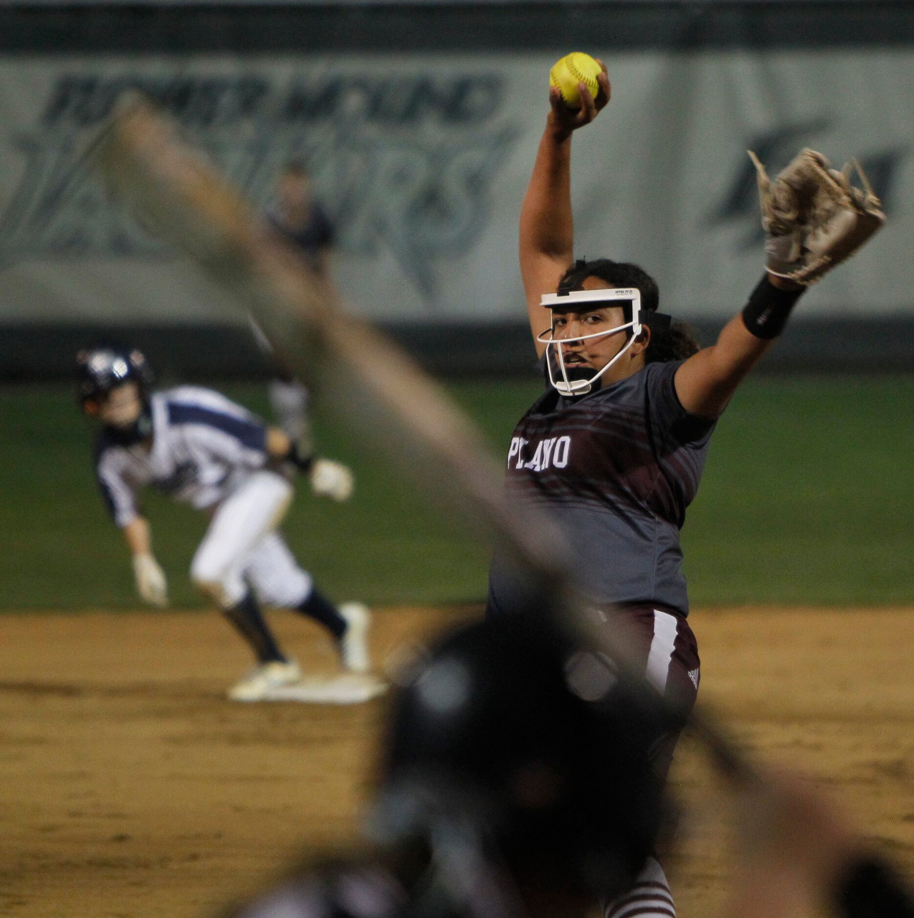 Plano pitcher Jayden Bluitt (20) prepares to deliver a pitch to a Flower Mound batter during...