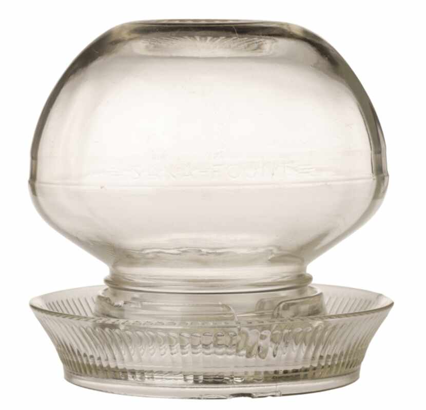 Under glass: Originally used as a chicken waterer, the glass orb with saucer makes a...