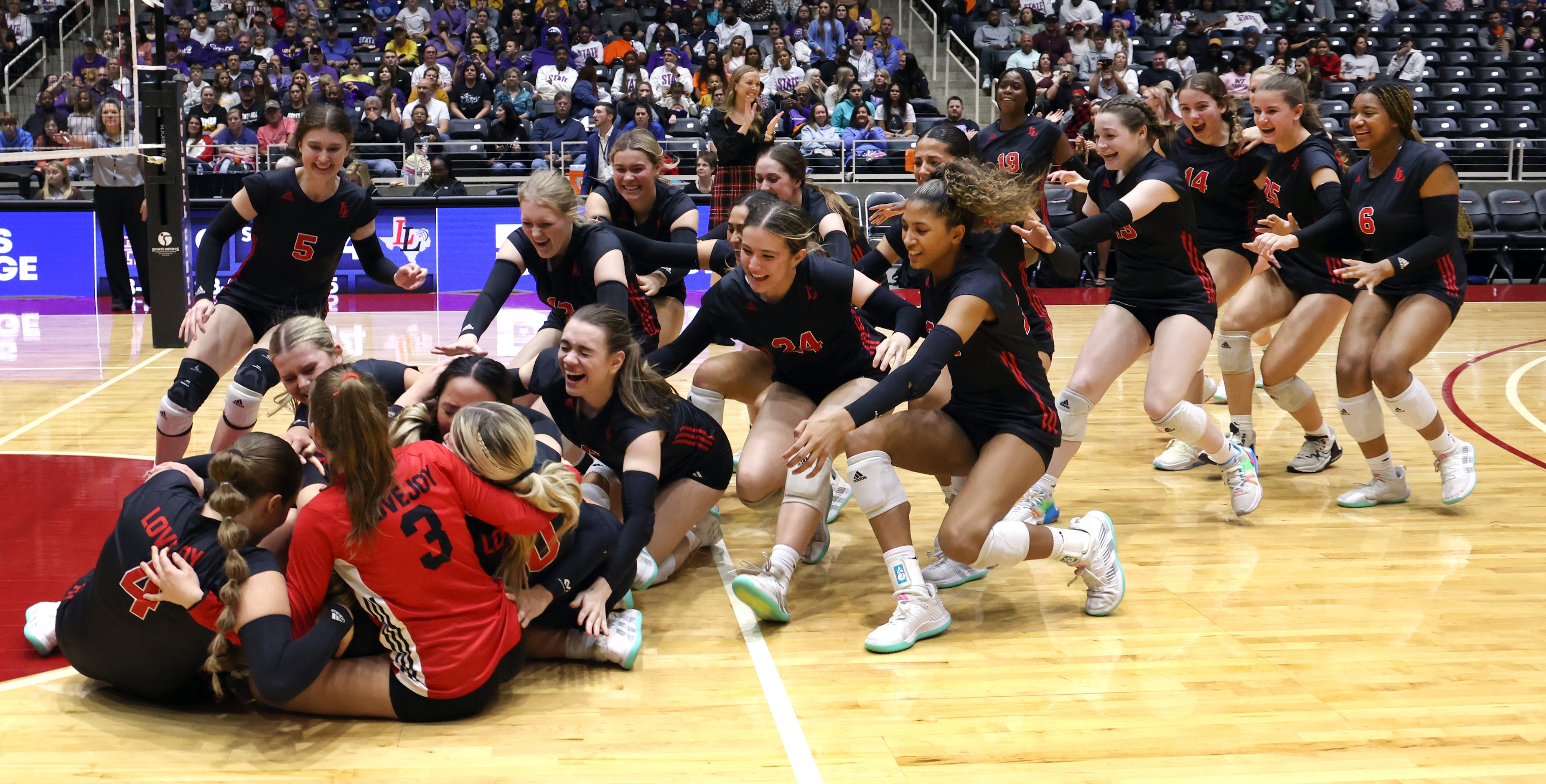 Lovejoy players storm the court in celebration of their straight sets victory over Liberty...