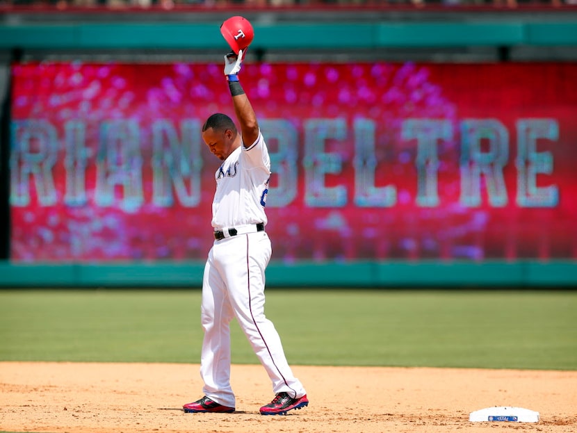 Texas Rangers' Adrian Beltre (29) acknowledges the crowd after hitting his 3,000th career...