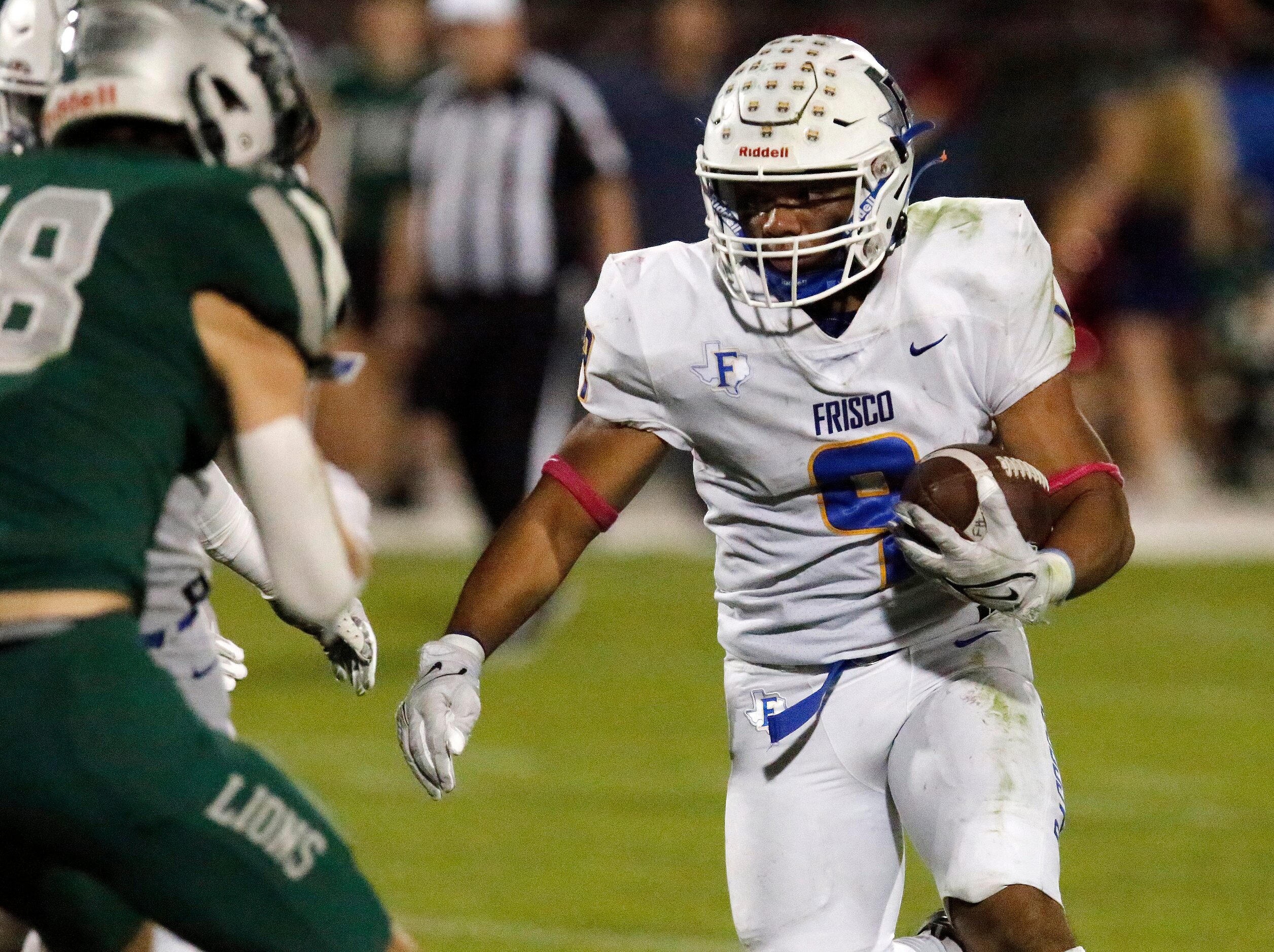 Frisco High School running back Keane Ramos (9) looks for room to run during the first half...