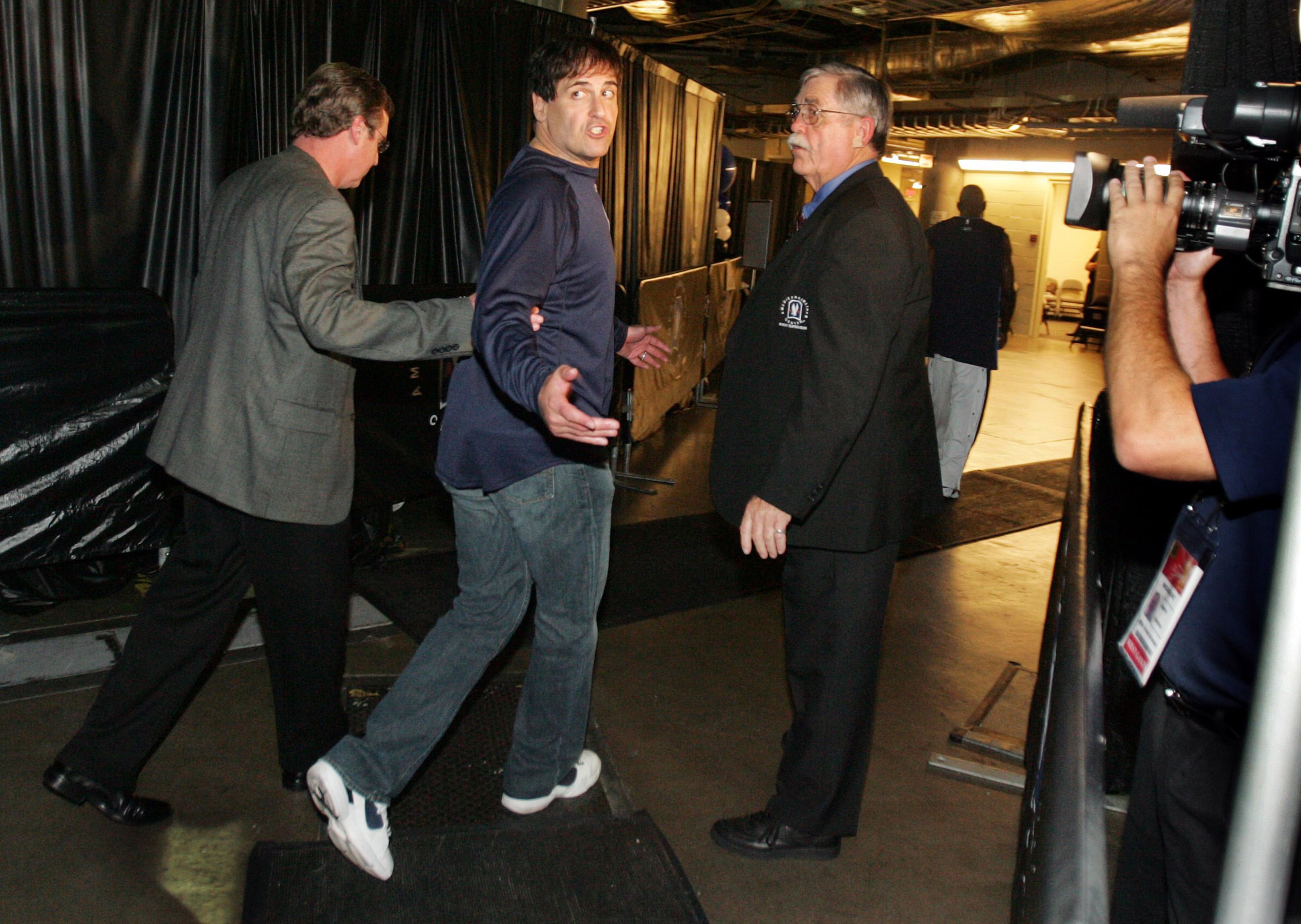 June 21, 2006: Mark Cuban yells at the cameras as he heads to the locker room after Game 6...