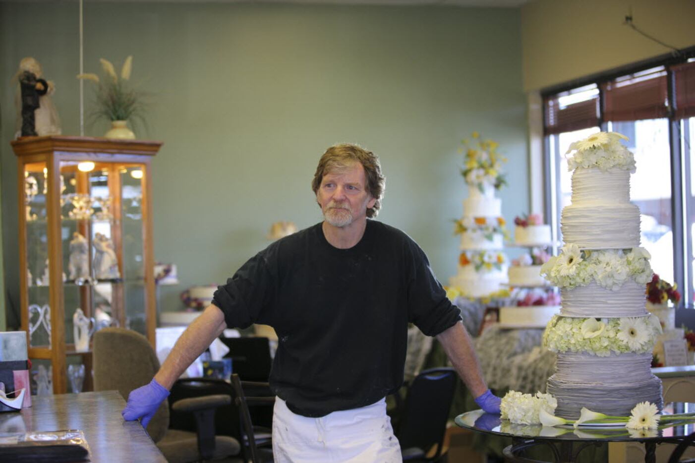 Jack Phillips at his business, Masterpiece Cakeshop, in Lakewood, Colo., in 2014. Phillips'...