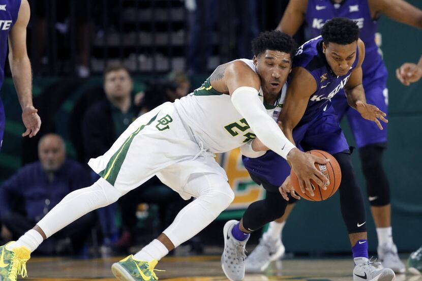 Baylor guard Ishmail Wainright (24) and Kansas State's Kamau Stokes, right, compete for a...