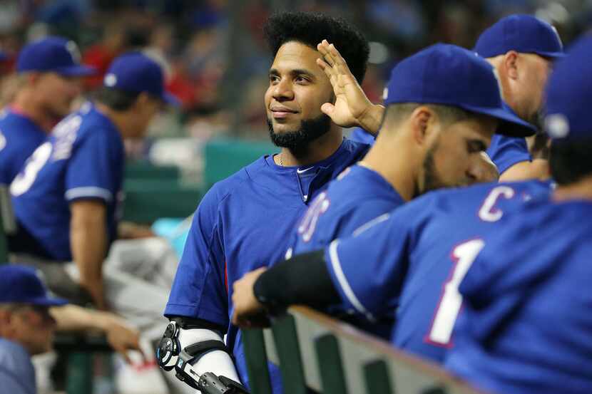 Texas Rangers shortstop Elvis Andrus (1) waves to fans during the seventh inning in a Major...