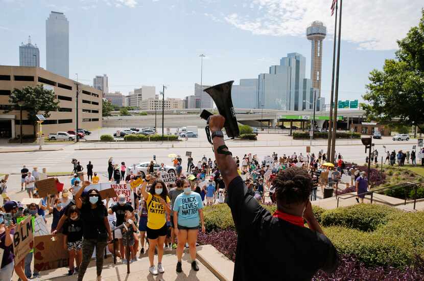 Pastor Ray Jordan leads demonstrators in chants of "Never again!" at the Frank Crowley...