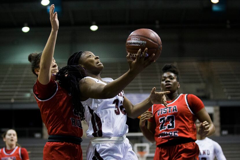 Plano guard Sanaa Murphy-Showers (32) goes up for a shot during the first quarter of a UIL...