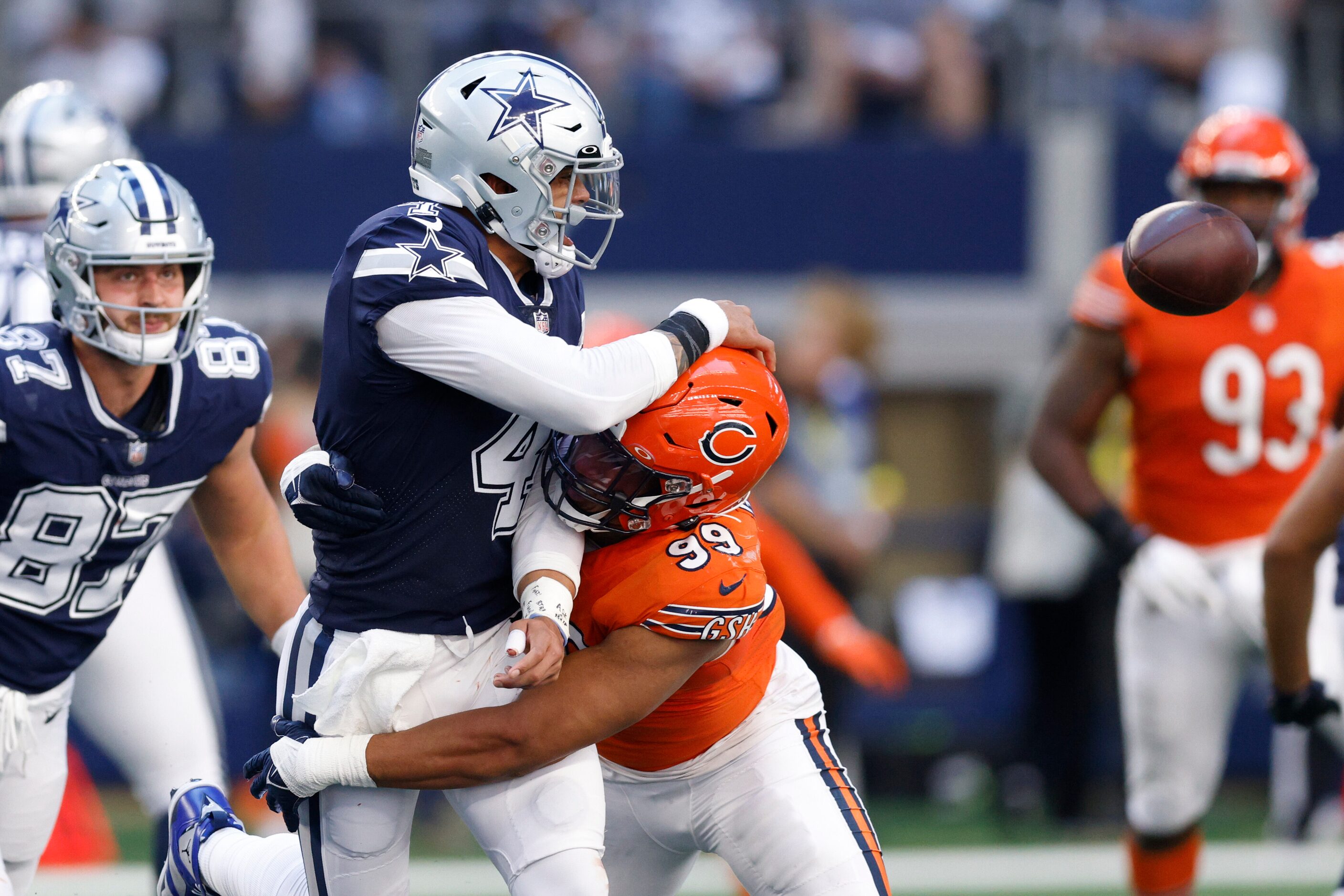 Chicago Bears linebacker Trevis Gipson (99) hits Dallas Cowboys quarterback Dak Prescott (4)...