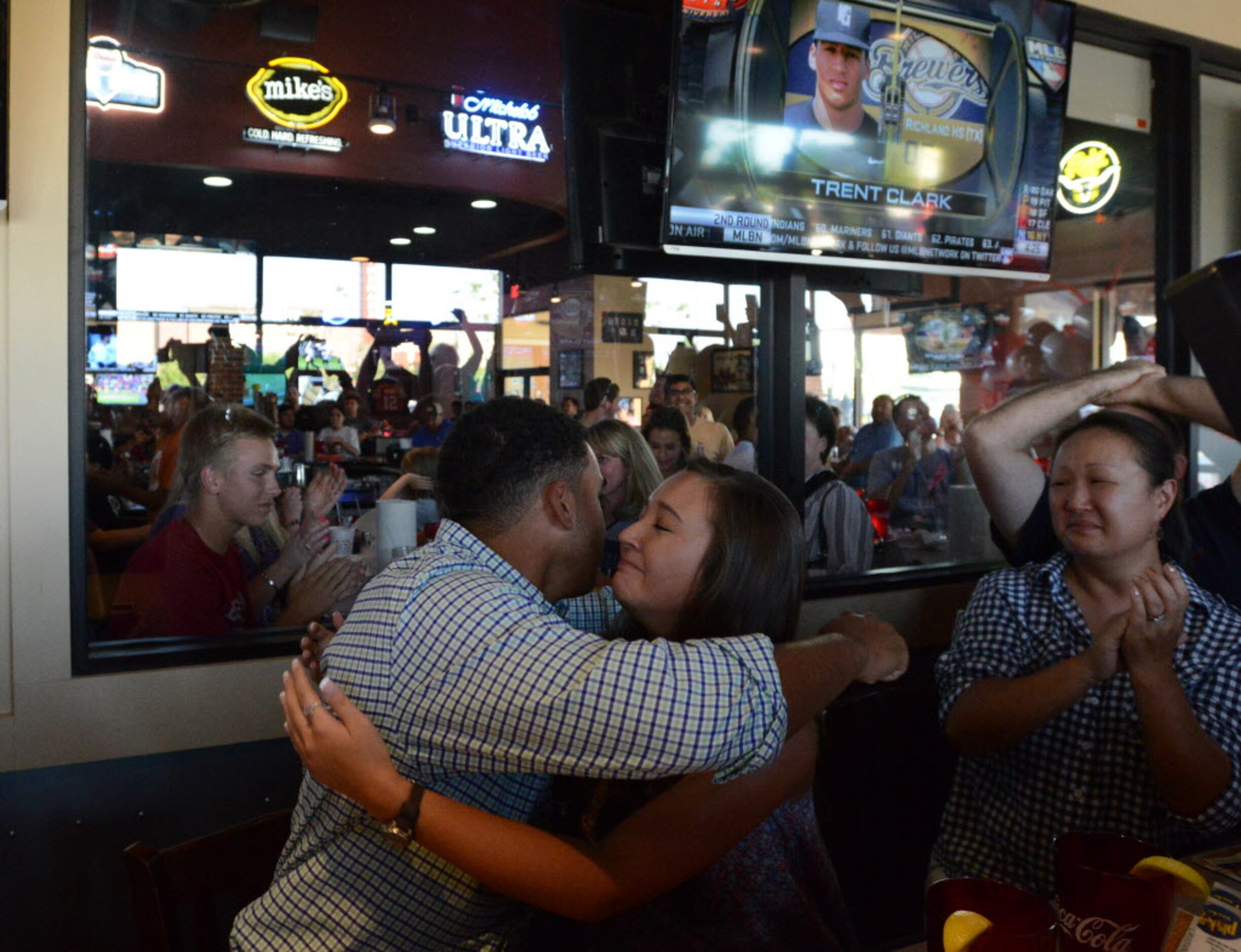 Trent Clark hugs his girlfriend Megan Buetow on learning that the Milwuakee Brewers have...