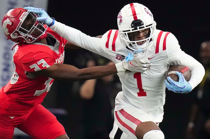 Duncanville’s Dakorien Moore (1) pushes past Galena Park North Shore’s Chace Calicut (33)...