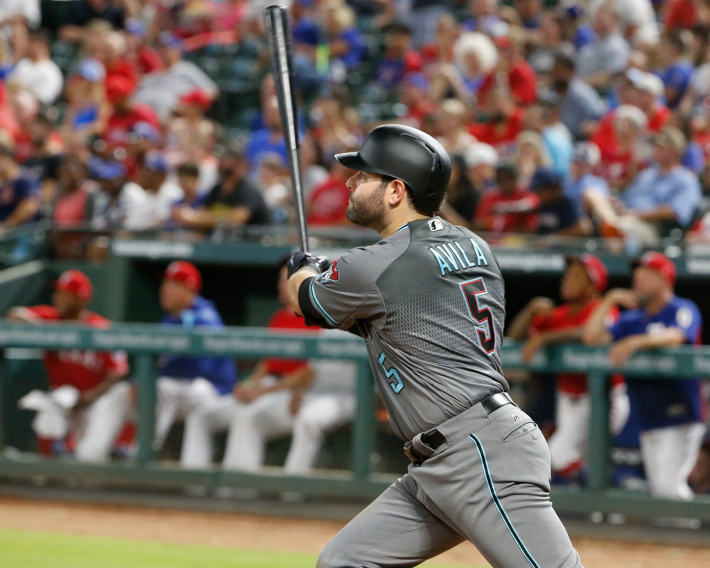 Arizona Diamondbacks' Alex Avila (5) watches the flight of his solo home run against the...