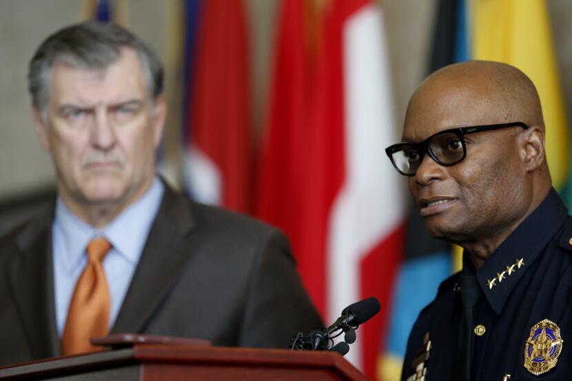 Dallas Police Chief David Brown (right) answers questions about the DPD crime reduction...