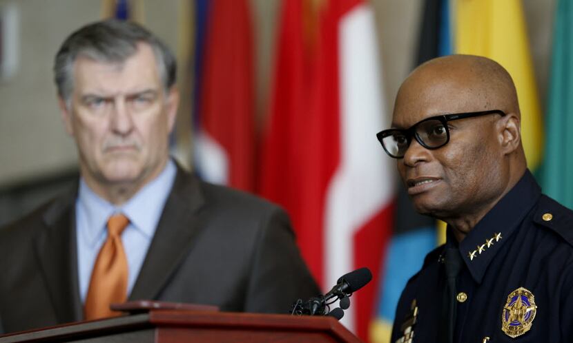 Dallas Police Chief David Brown, right, answers questions about the DPD crime reduction...