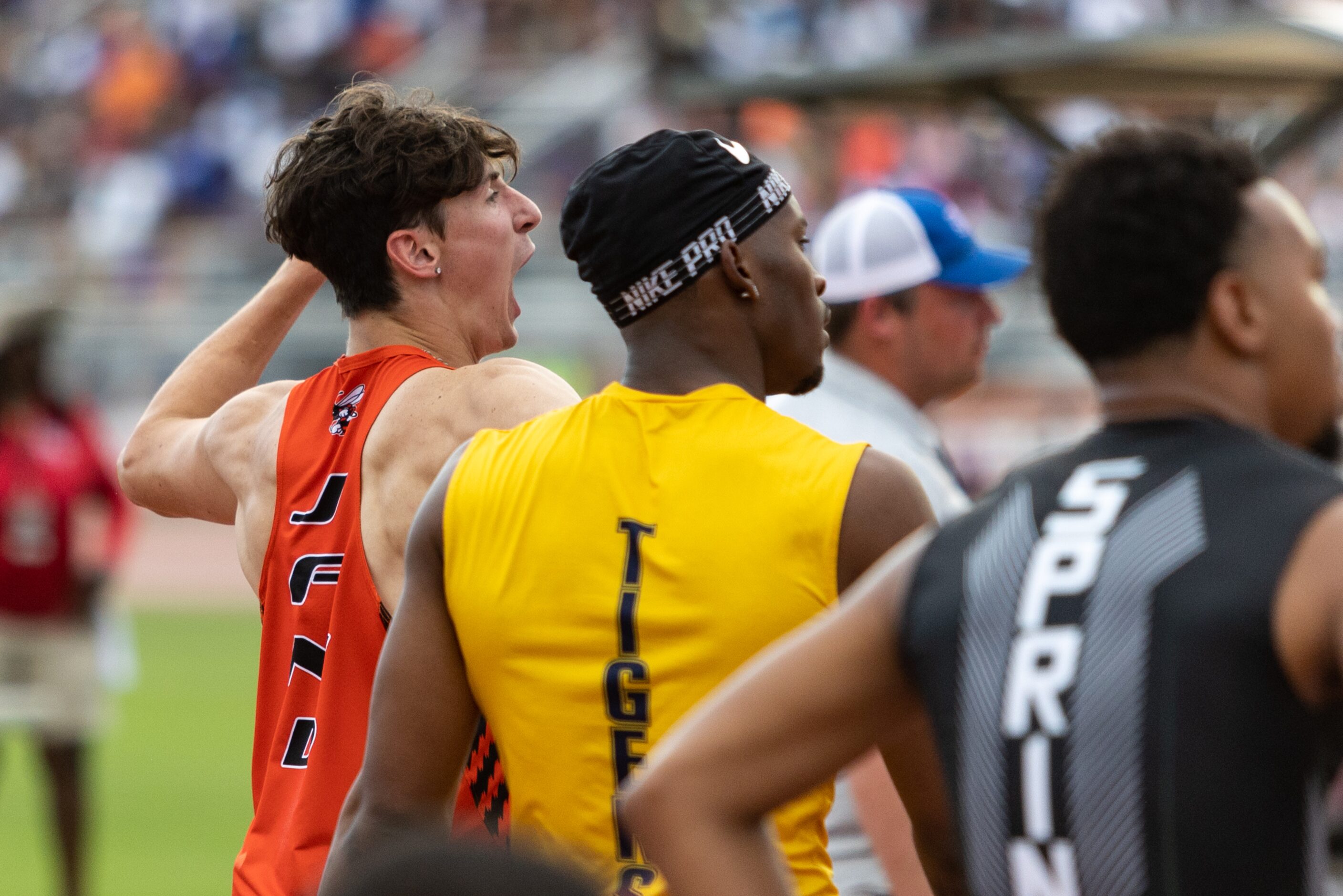 Samuel Alves of Rockwall, left, reacts to the results of the boys’ 110-meter hurdles at the...