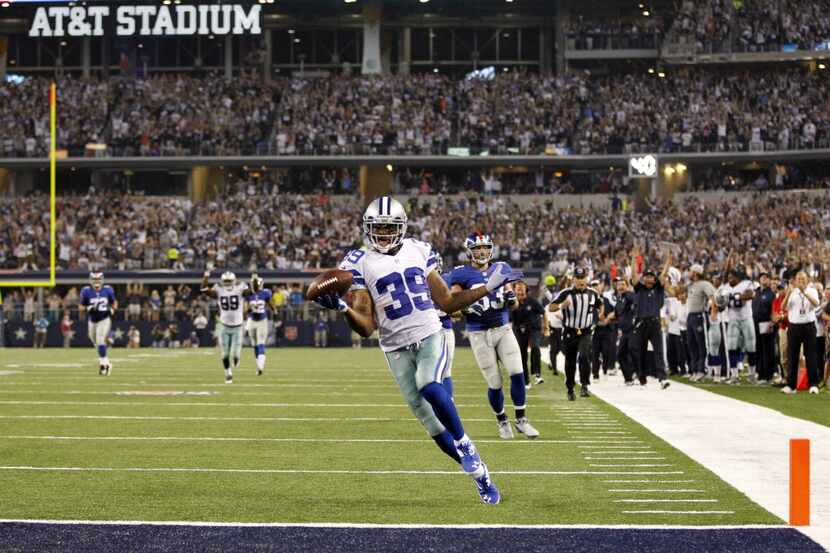 Dallas Cowboys cornerback Brandon Carr (39) scores a touchdown off an interception from New...