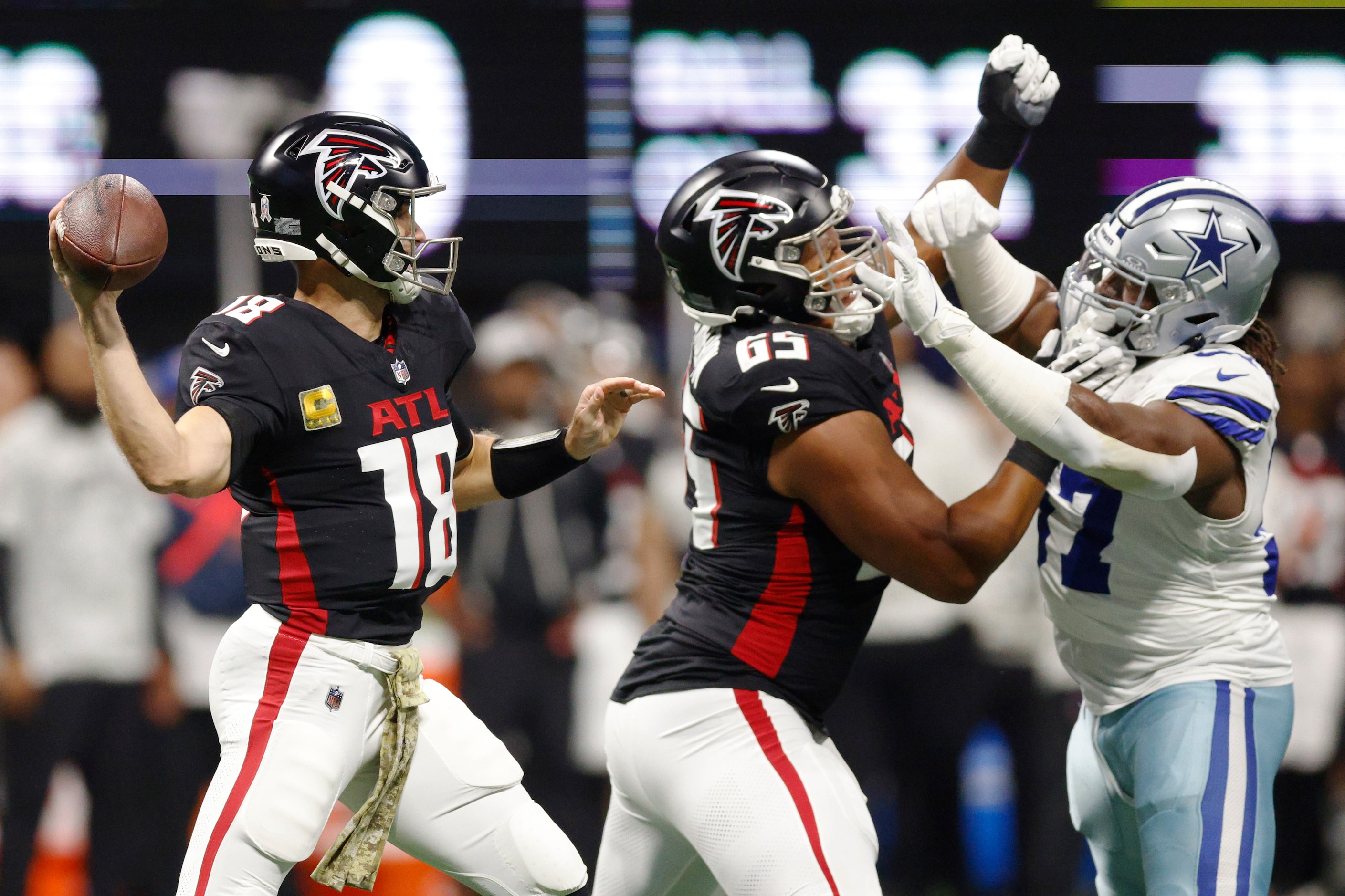 Dallas Cowboys defensive tackle Osa Odighizuwa (97) pressures Atlanta Falcons quarterback...