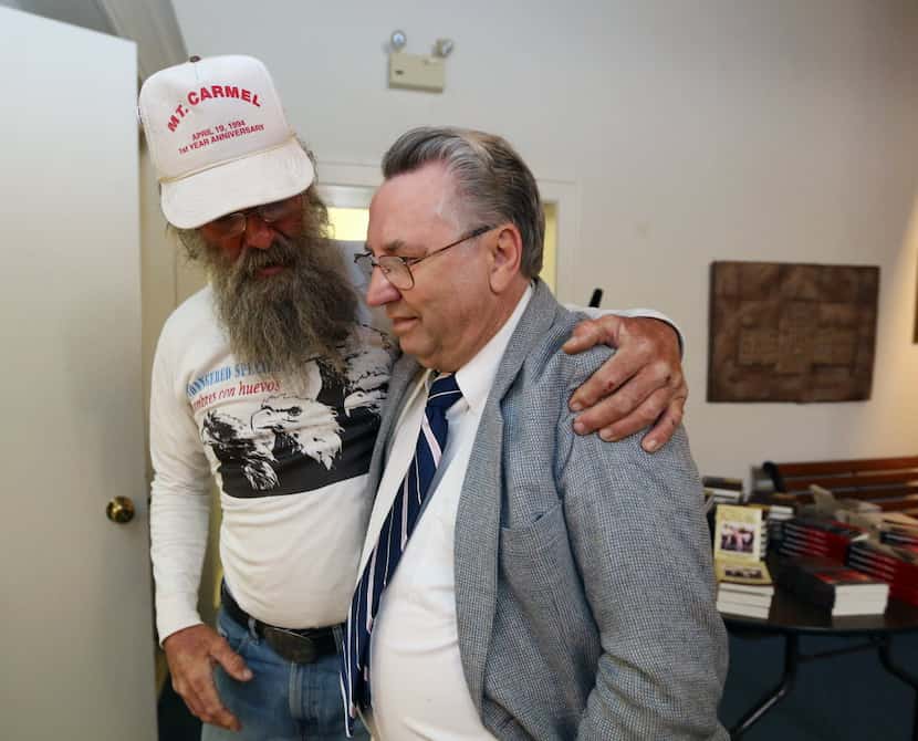 Branch Davidian Clive Doyle, right, gets a hug from longtime friend Rick Donaldson, left,...