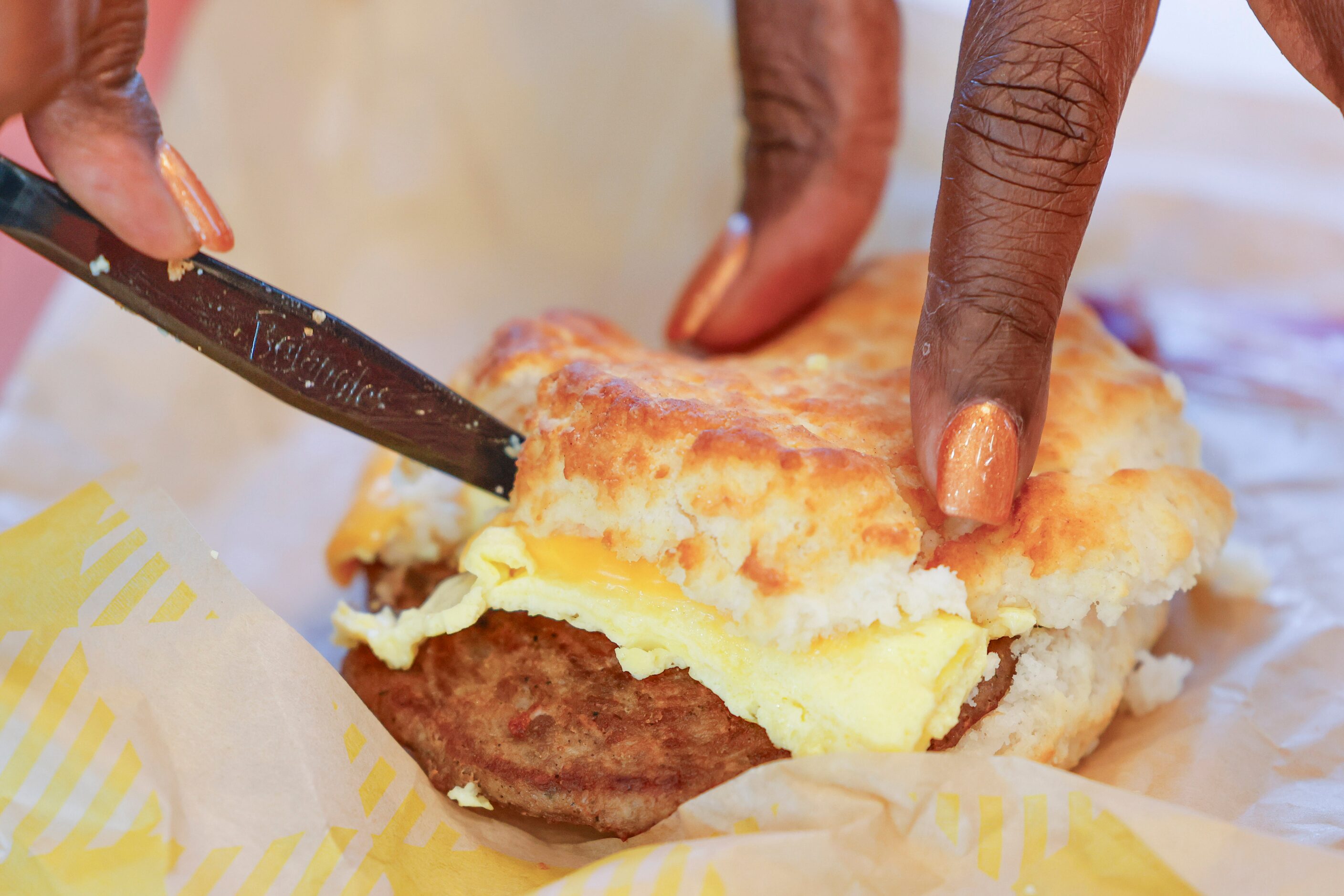 Yvonne Beacham cuts her biscuit before trying her birthday meal during the opening day of...