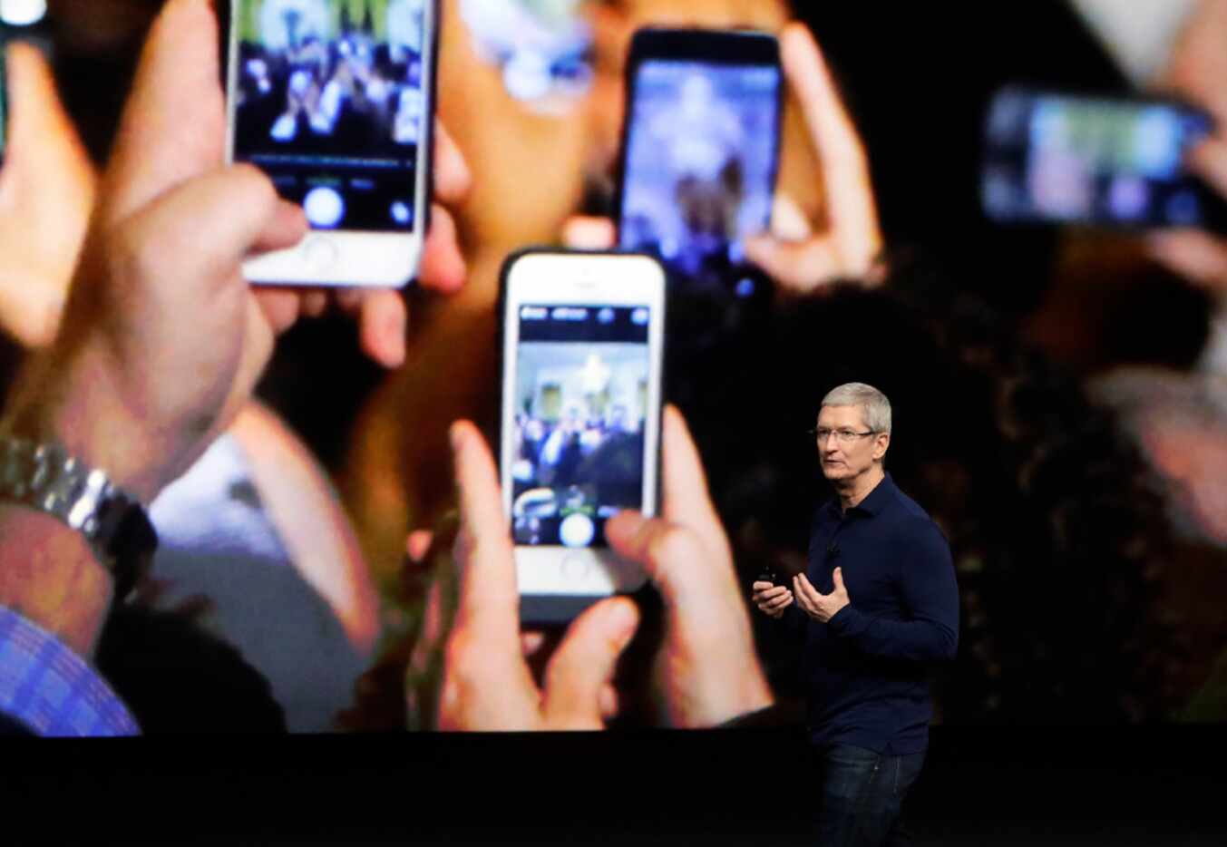 Apple CEO Tim Cook announces the new iPhone 7 during an event to announce new products...