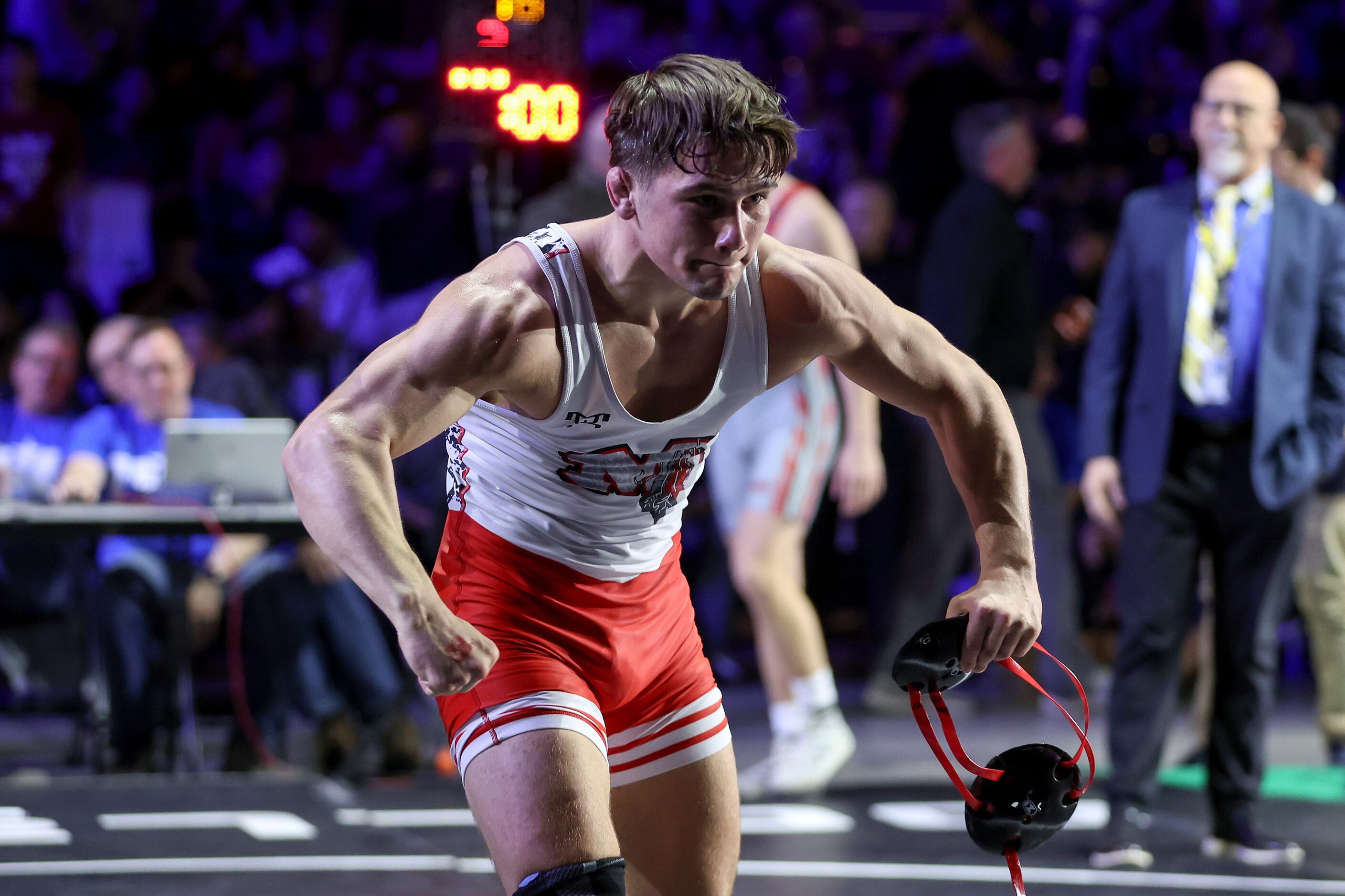 Grayson Carpenter of Arlington Martin (red) celebrates after defeating Matteo Nikolov of...