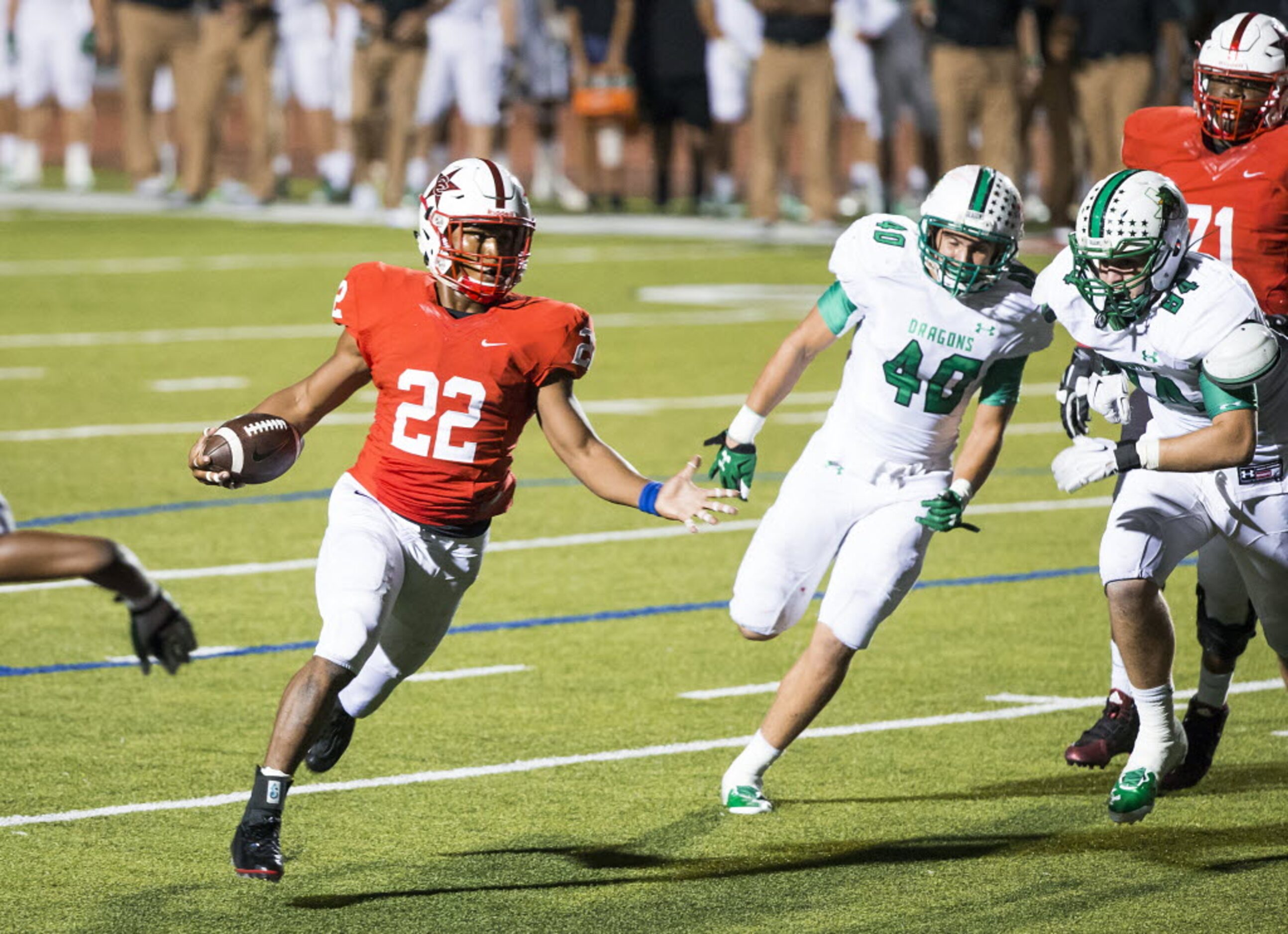 Coppell running back Brandon Rice (22) past Southlake Carroll linebacker Grant Phelps (40)...